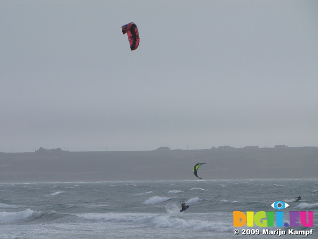 SX02952 Kitesurfers jumping from wave at Tramore beach